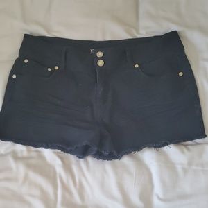 Female, black cutoff shorts